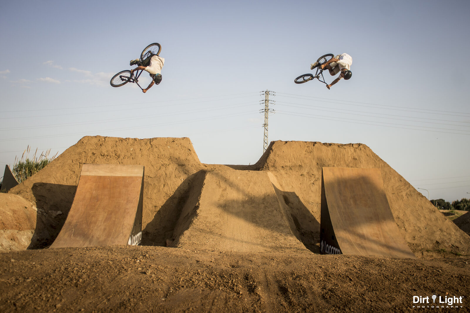 Two riders in the air at the same time over the dual line