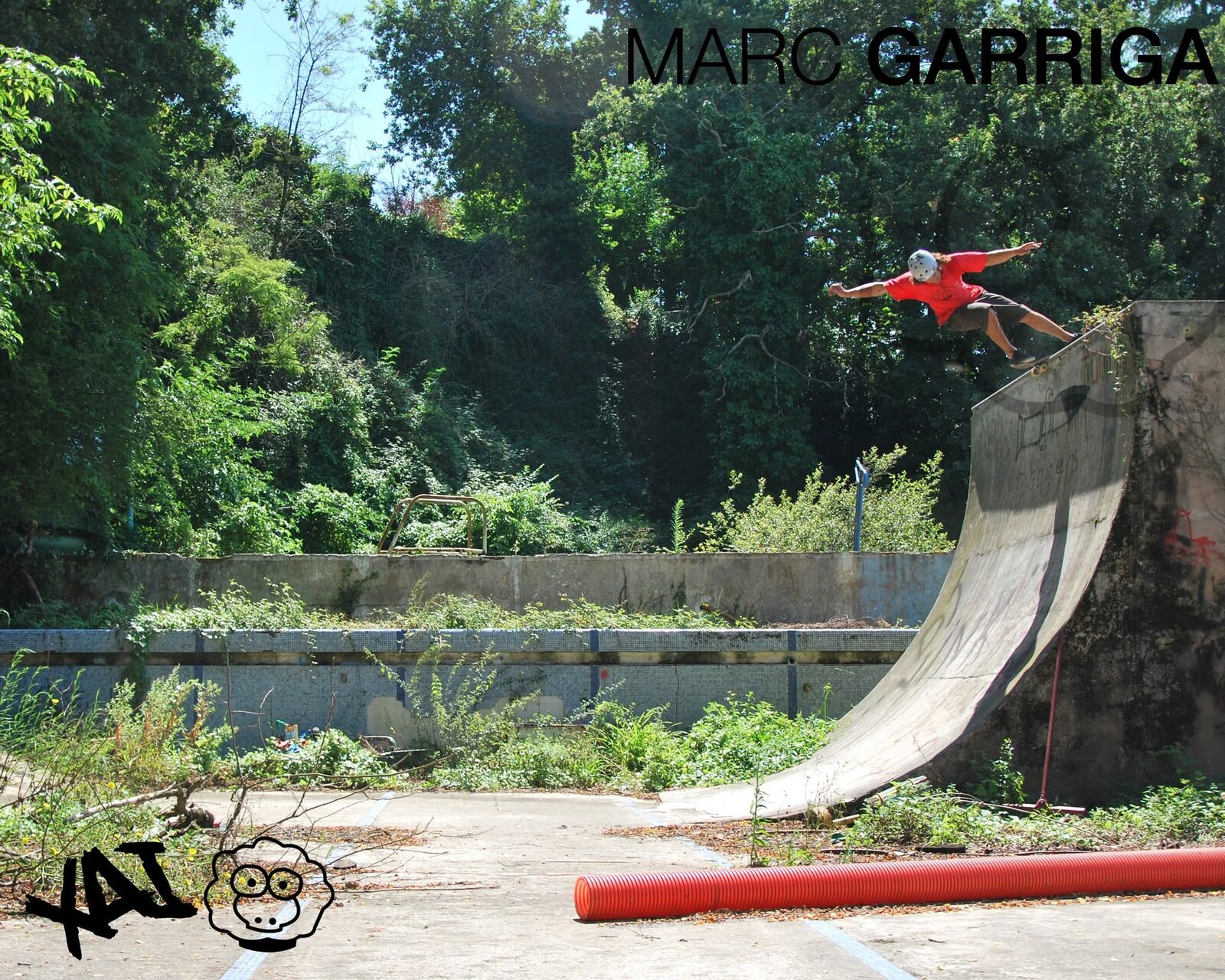 Campaign frame: Marc Garriga riding the lip of an abandoned, overgrown swimming pool