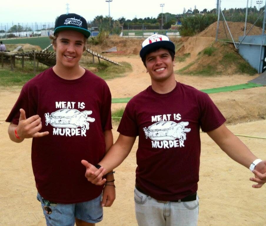Thomas Lemoine and Anthony Villoni at the dirt jumps, both wearing dark red XAI MEAT IS MURDER shirts