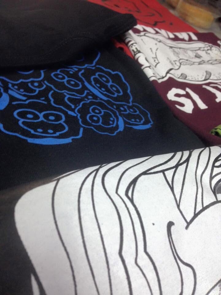Close-up of printed fabric showing repeated blue sheep icons