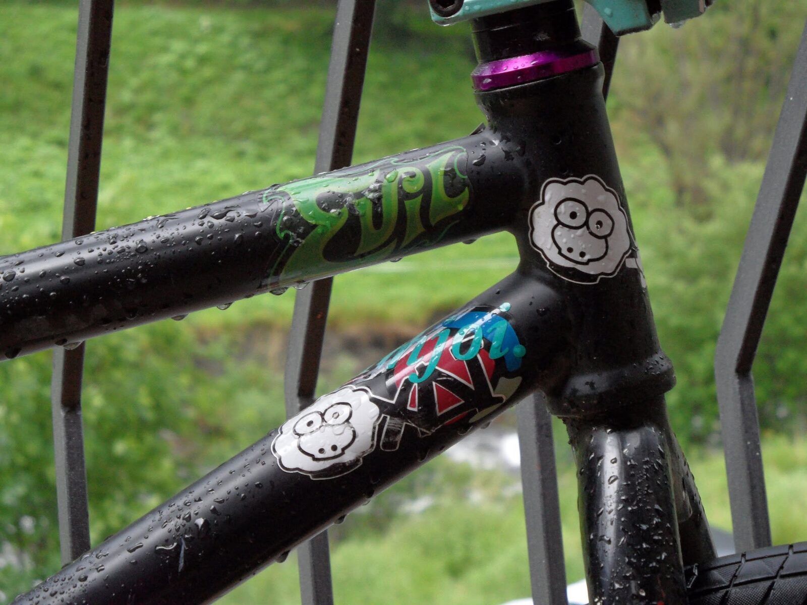 A black BMX frame with a XAI sheep sticker on the down tube